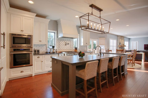 Extra White Cabinets and gray kitchen island for a farmhouse style kitchen in Sinking Spring, Pennsylvania