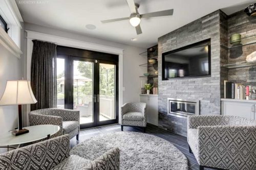 Transitional Family Room Featuring a Custom Entertainment Area With Cabinetry on Either side of the Fireplace