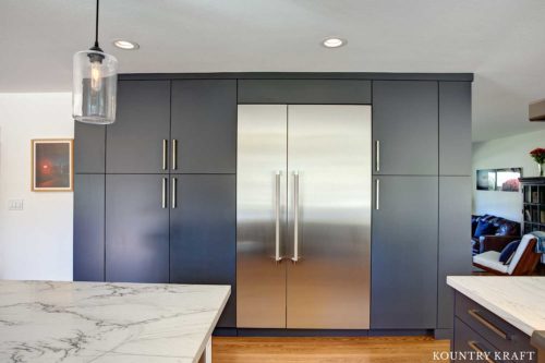 French Beret Cabinets Crafted for a Large Kitchen Pantry to Create a Polished Look 