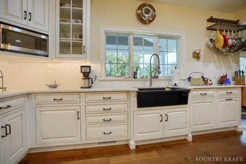 White Beaded Inset Cabinets with a Glaze Finish for a traditional style kitchen in Wernersville, Pennsylvania