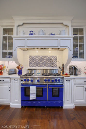 Blue Range with White Cabinets and Custom Range Hood in Wernersville, Pennsylvania