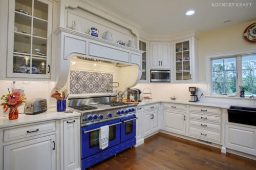 White Beaded Inset Cabinets with a Glaze Finish and Blue Range in Wernersville, Pennsylvania