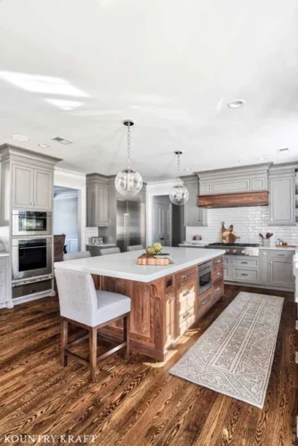 Wooden Features in this Kitchen Create Harmony with the Gray Kitchen Cabinets