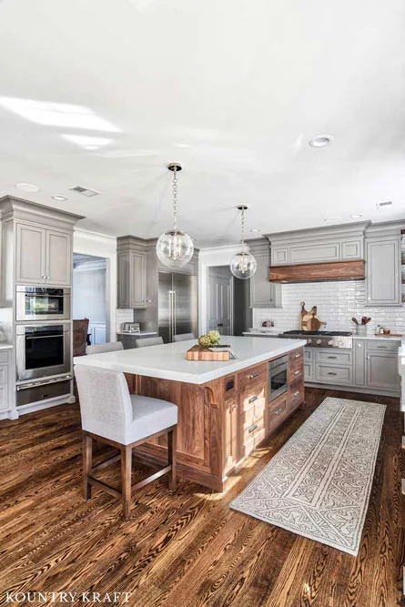 Wooden Features in this Kitchen Create Harmony with the Gray Kitchen Cabinets