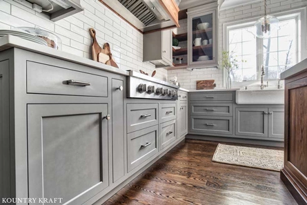 Tiny Drawers were Designed to Utilize Every Empty Space around the Gray Kitchen Cabinets 