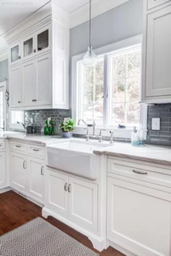White farmhouse sink with subway tile backsplash and hard maple cabinets Madison, New Jersey