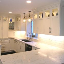 White kitchen with hard maple cabinetry, sink, and L shaped counter Stamford, CT