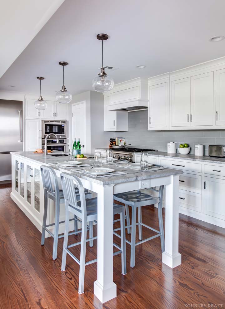 Kitchen with hard maple cabinets, island that doubles as a table, and chairs Madison, NJ
