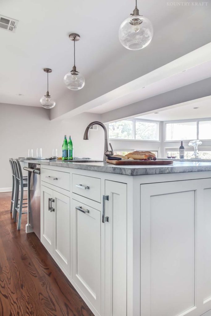 Close up of kitchen island with built in dishwasher and sink Madison, NJ