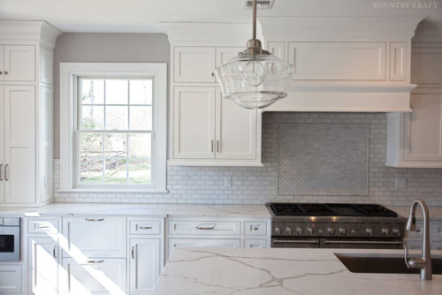 Kitchen with white hard maple cabinets, island, and range Madison, NJ
