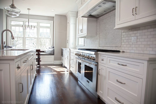 Hard maple kitchen with oven, range, and island with sink Madison, NJ