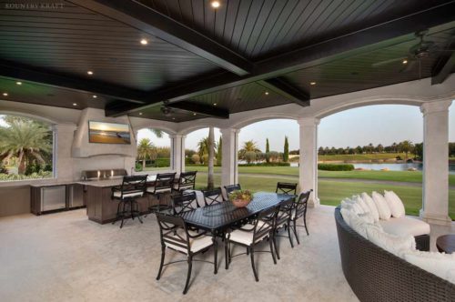 Outdoor custom home bar with custom cabinets for a backyard in naples florida