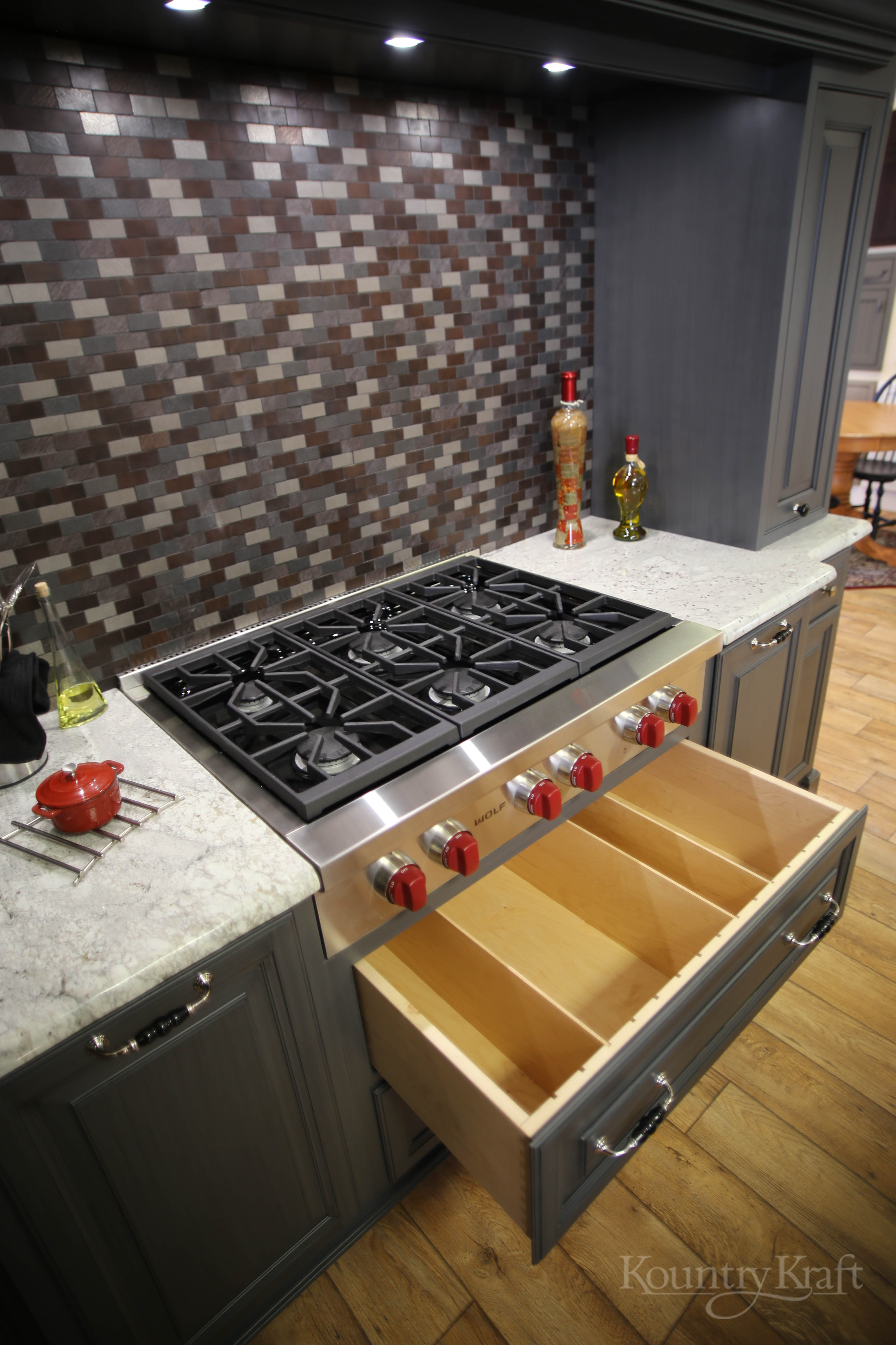 Kitchen Cabinet Ideas PA with wolf range and tile backsplash