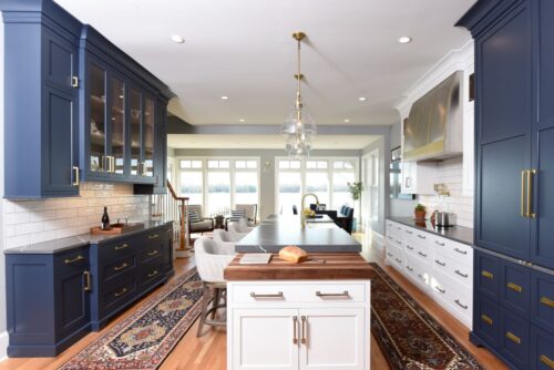 Discover a custom white and blue kitchen and butler’s pantry in Edgewater, MD, designed by Tina Colebrook Kitchens with Kountry Kraft’s hard maple cabinets. Functional design meets modern style.
