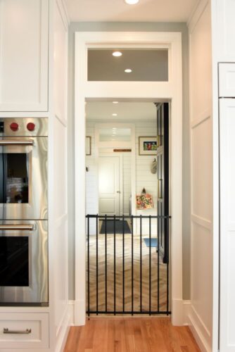 A special gated area where family dogs can relax while watching everything happening in the kitchen. The gate tucks away easily, keeping the dogs close without getting underfoot.