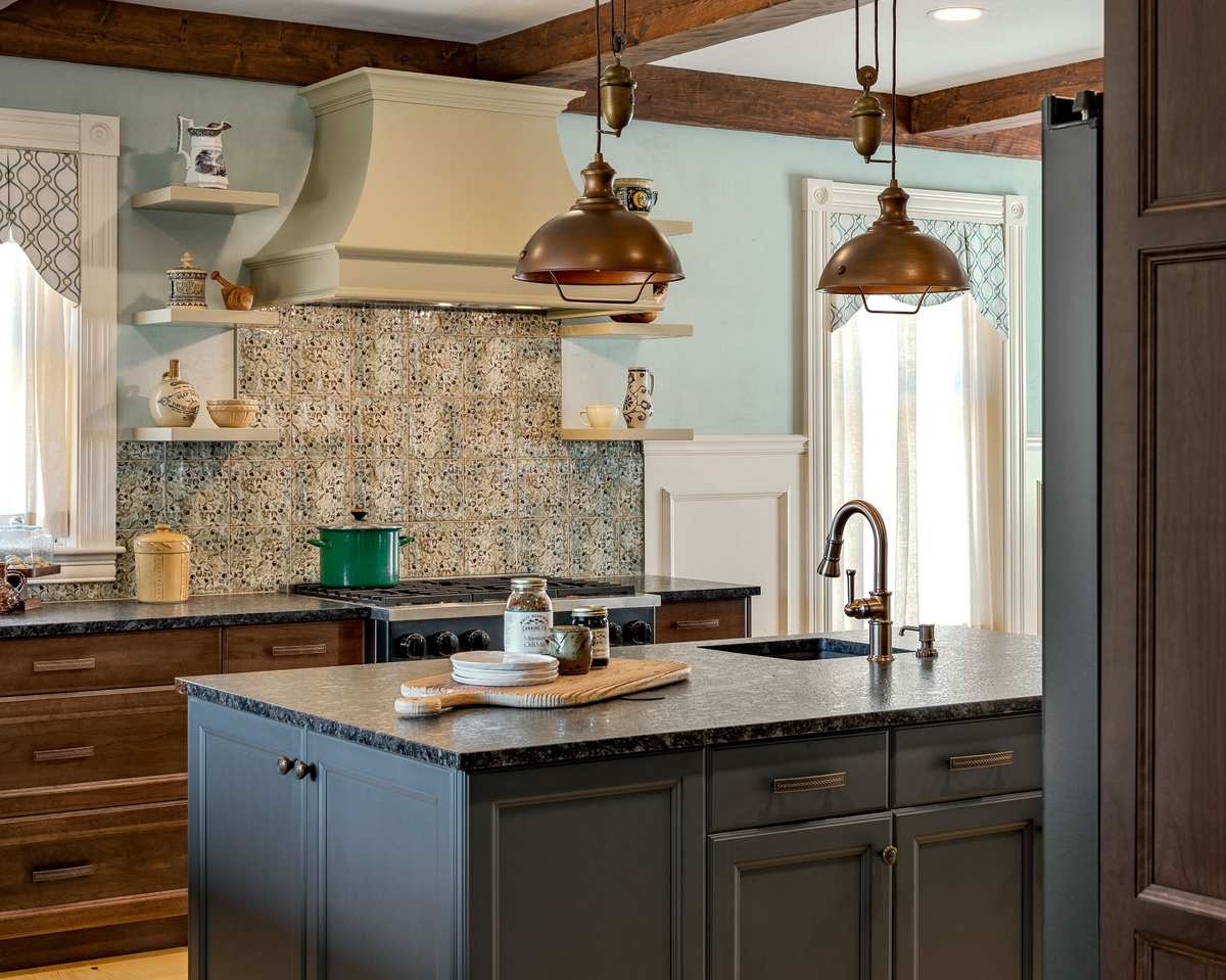 Rustic-modern kitchen remodel White Mountains NH with Kountry Kraft custom cabinetry, bronze pendant lighting, and mountain-inspired design.