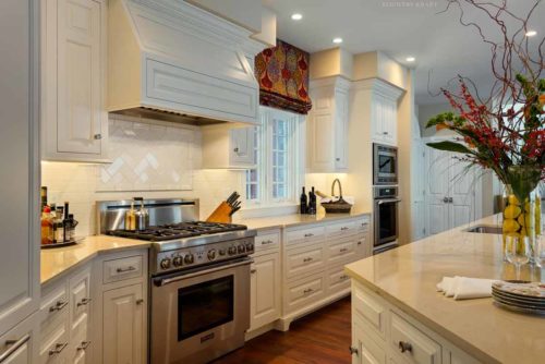 White kitchen cabinet, range, and island Cape Neddick, ME