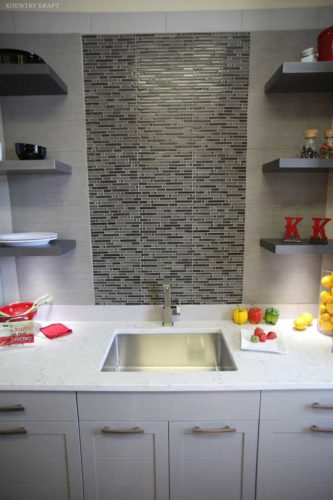 Counter with custom white kitchen cabinets, sink and backsplash Birdsboro, PA