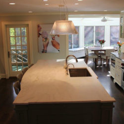 White kitchen cabinets and island with built in sink Bethesda, MD