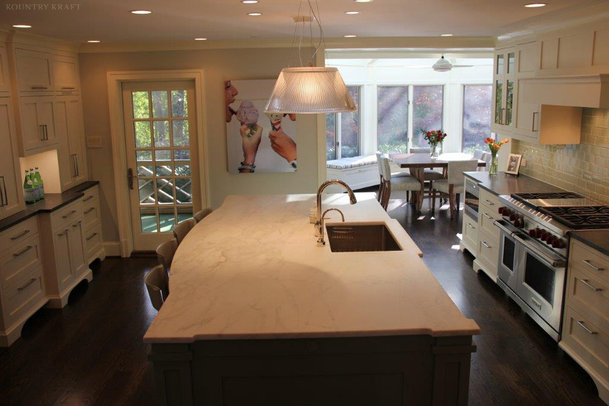 White kitchen cabinets and island with built in sink Bethesda, MD