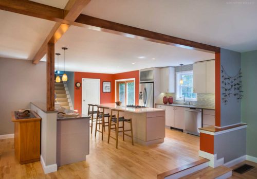 Kitchen with orange and white walls and Contemporary Cabinets Exeter, NH