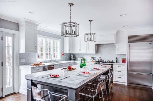 A kitchen focal point was created using a custom range hood and custom cabinetry