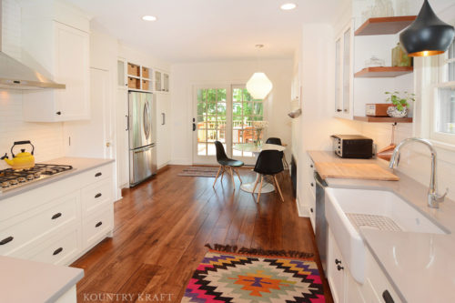 Farm house kitchen idea including sink, refrigerator, and table with chairs Upper Montclair NJ