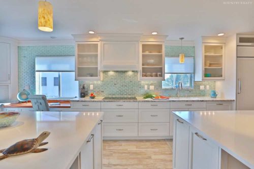 Transitional white cabinets and close up of island countertops and turtle decoration Venice, FL
