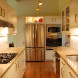 Kitchen cabinets, counters with stove top and sink, refrigerator, oven, and microwave Alexandria, VA