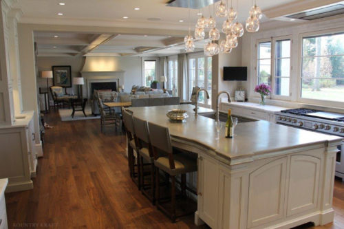 White cabinets and kitchen island with built in dual faucet sink Alexandria, VA