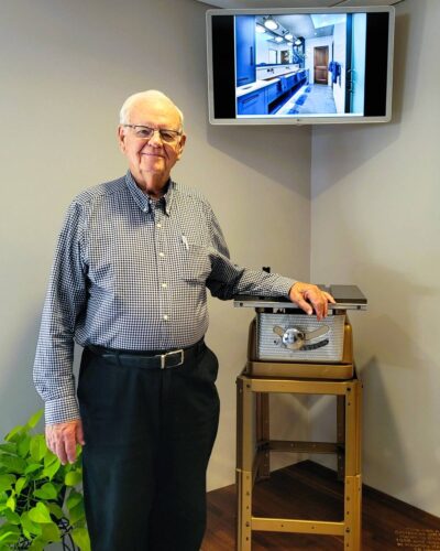 Elvin Hurst Sr. of Kountry Kraft Cabinet Makers with the original Sears table saw that started the company in 1959.