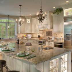 Large kitchen island with a built-in undermount sink and three chairs Enola, PA