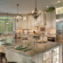 Large kitchen island with a built-in undermount sink and three chairs Enola, PA