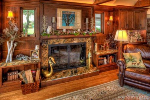 Custom Living Room Cabinets in Winchester, Massachusetts feature a fireplace cabinet surround