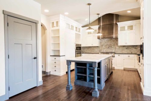 Island with shelf space, door, and white dove painted cabinets Mohnton, PA