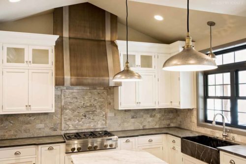 Luxury kitchen cabinets, sink, range, and beautiful range hood Mohnton, PA