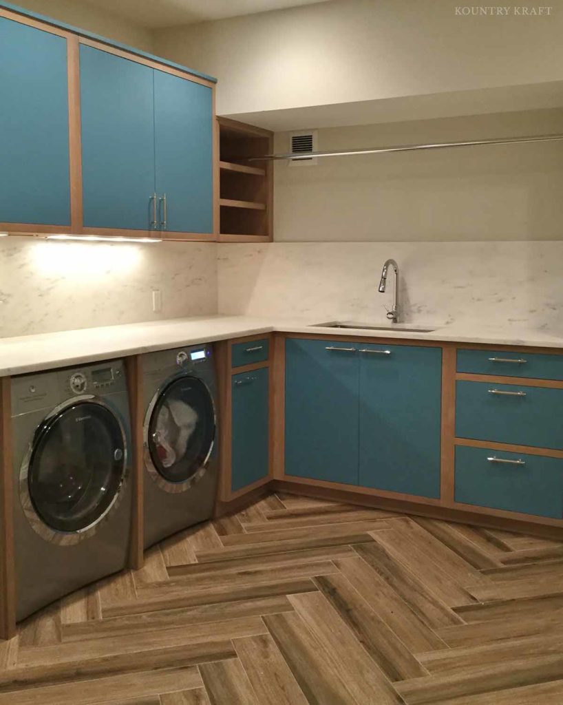 Laundry room with manitou blue cabinets and sink Greenwich, CT