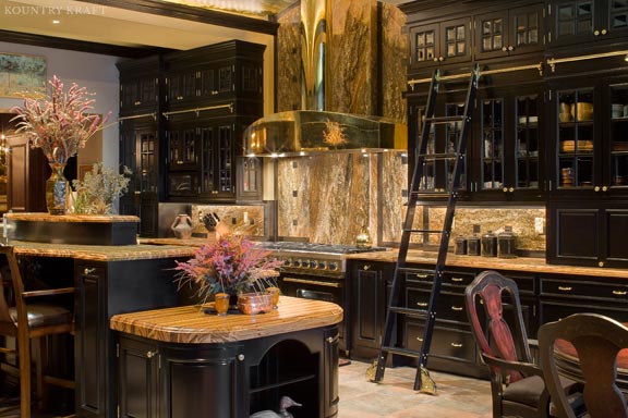 Black painted maple cabinets with sliding ladder, range, gold range hood, and island Baltimore, MD