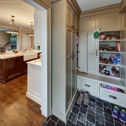 Mudroom storage cabinets and kitchen with island in background Short Hills, NJ
