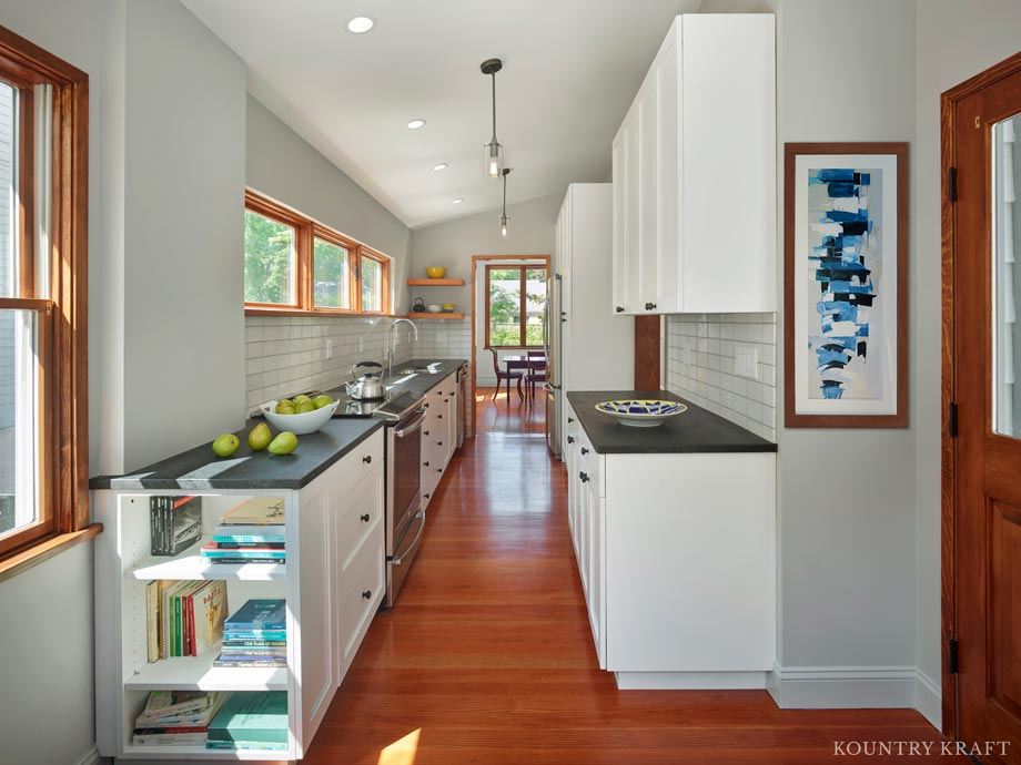 Narrow Kitchen Cabinets with wood floors and subway tile for a home in Princeton, New Jersey