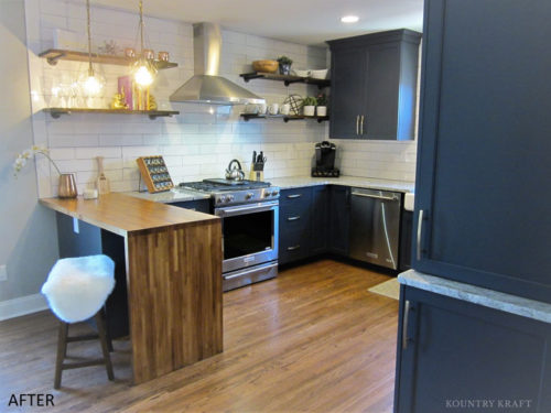 Kitchen with navy cabinets, range, and wood countertop Charlotte, NC