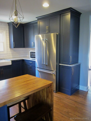 Navy kitchen with stainless steel refrigerator and microwave Charlotte, NC