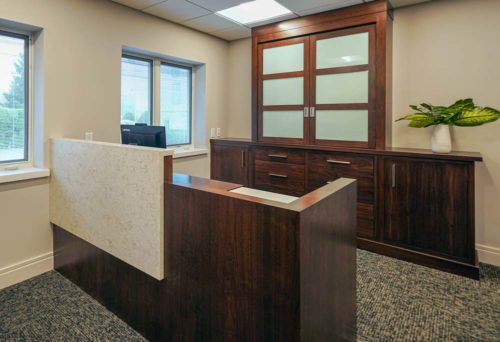 Office reception island desk with waterfall accent