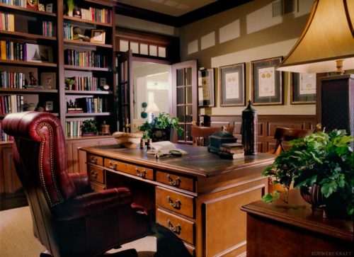Custom office cabinetry, desk, and red luxury leather chair in Media, Pennsylvania