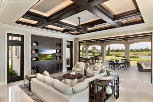 Open air family room with sofa, cabinetry, and a television Naples, FL