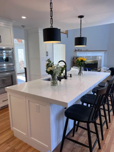 quartz countertops with a white kitchen design