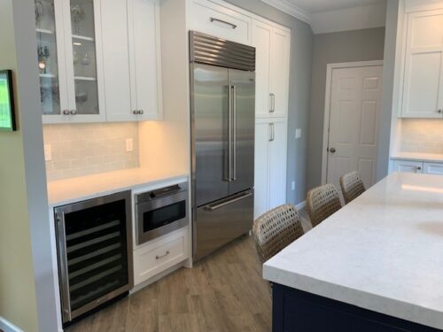 This is a photo containing the Subzero refrigerator, the double oven, and microwave from a kitchen in Henderson Nevada. 