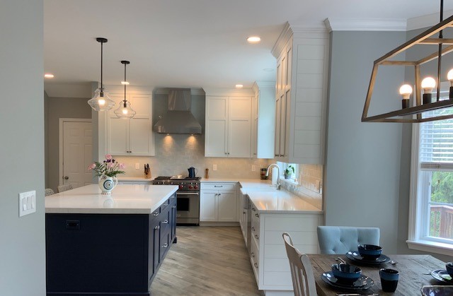 This is a picture of a white and blue kitchen in Henderson Nevada with custom cabinets by Kountry Kraft Cabinetry.