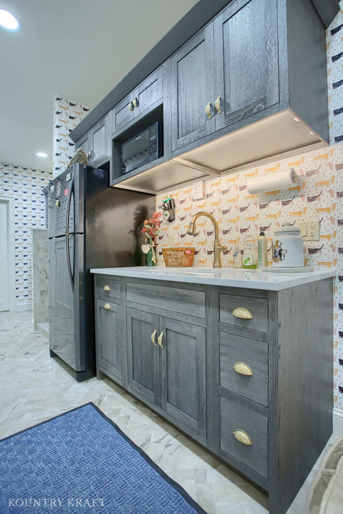 Silver Fox Laundry Room Cabinets with Gold Hardware for a home in Wernersville, Pennsylvania