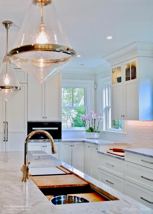 Simply White Cabinetry for a large u shaped kitchen in New Canaan, Connecticut